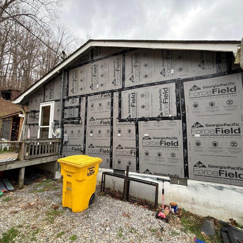 Weather barrier system installation on exterior wall