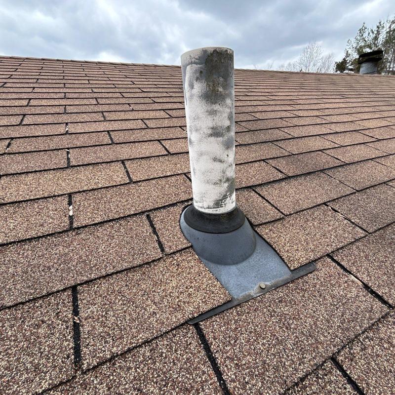 Roof vent pipe flashing with granule loss on shingles