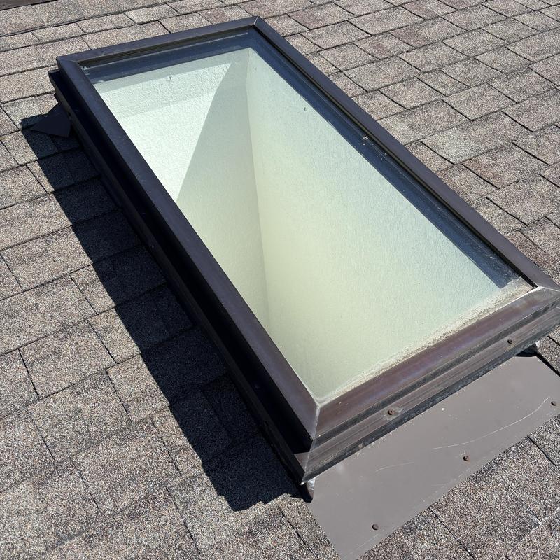Skylight on asphalt shingle roof in Hayden, ID Skylight on asphalt shingle roof in Hayden, ID
