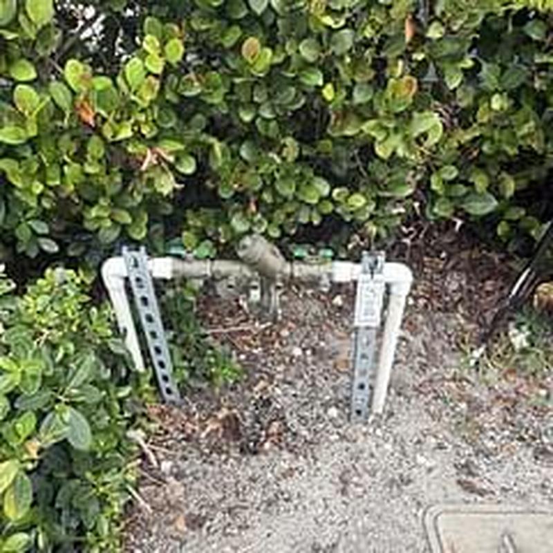 Backflow prevention device with inspection tags outdoors Backflow prevention device with inspection tags outdoors