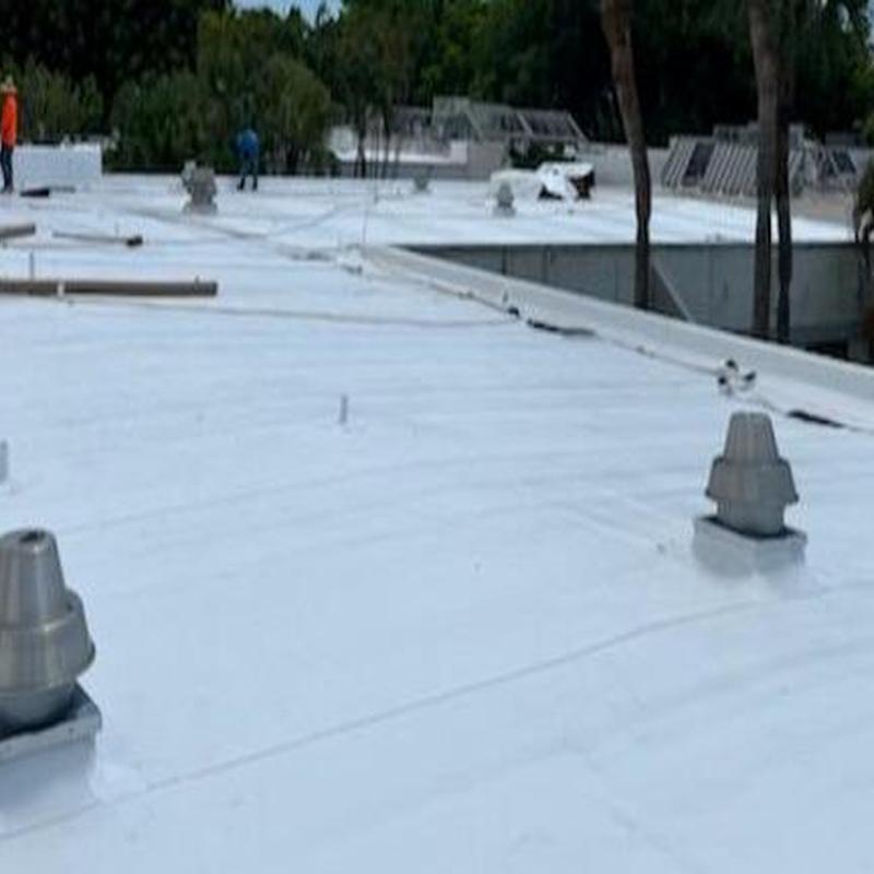 Commercial TPO roofing membrane installation with vents Commercial TPO roofing membrane installation with vents