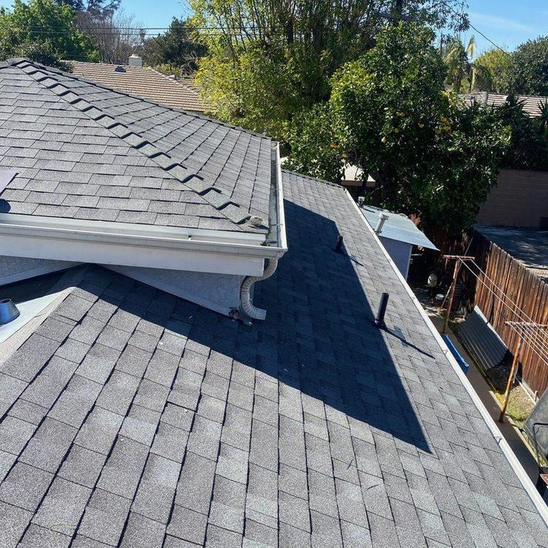 Shingle roof with gutters on residential house Shingle roof with gutters on residential house