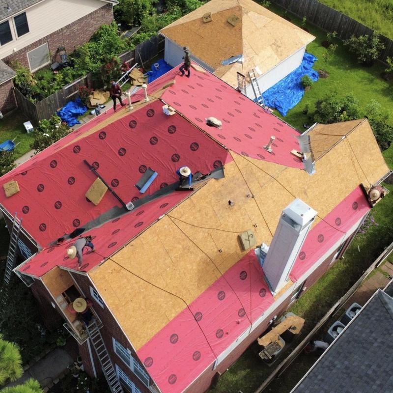 Synthetic roofing underlayment installation on residential roof