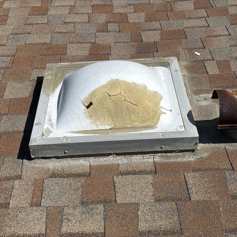 Skylight dome with cracked and damaged sealant Skylight dome with cracked and damaged sealant