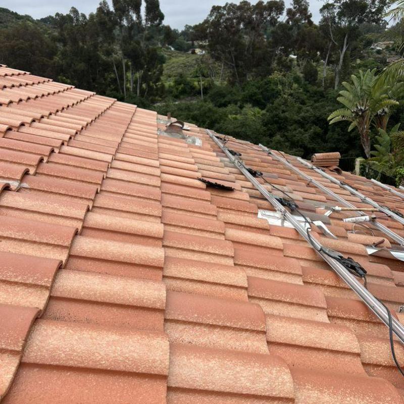 Tile roof with solar panel mounts and wiring Tile roof with solar panel mounts and wiring