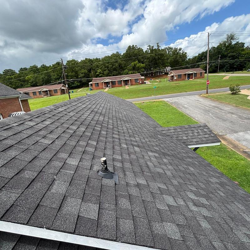 Asphalt shingle roof with pipe vent flashing