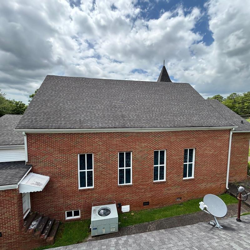 Shingle roof with aging, weathering, and wear on church