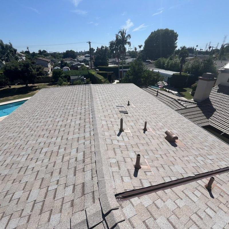 New shingle roof installation on residential house New shingle roof installation on residential house