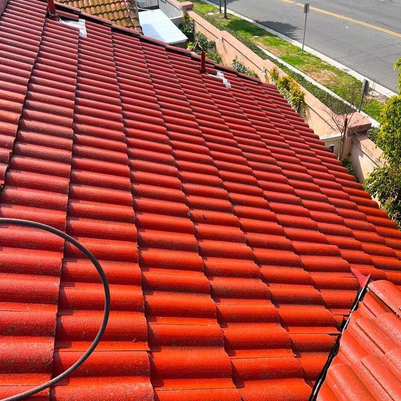 Red tile roof installation on residential home Red tile roof installation on residential home