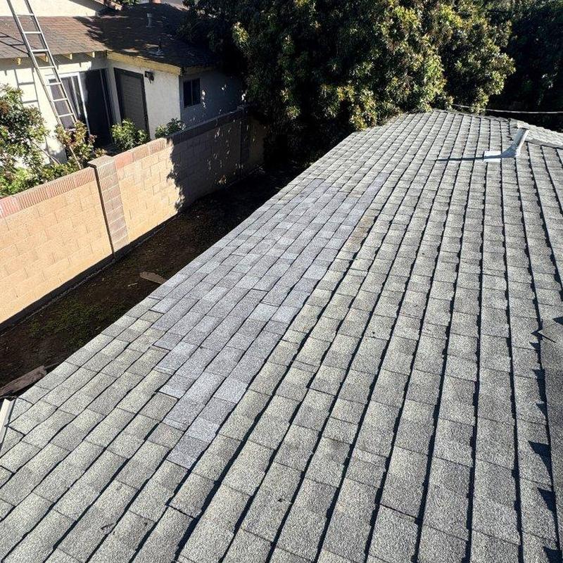 Shingle roof on residential house in bright sunlight Shingle roof on residential house in bright sunlight