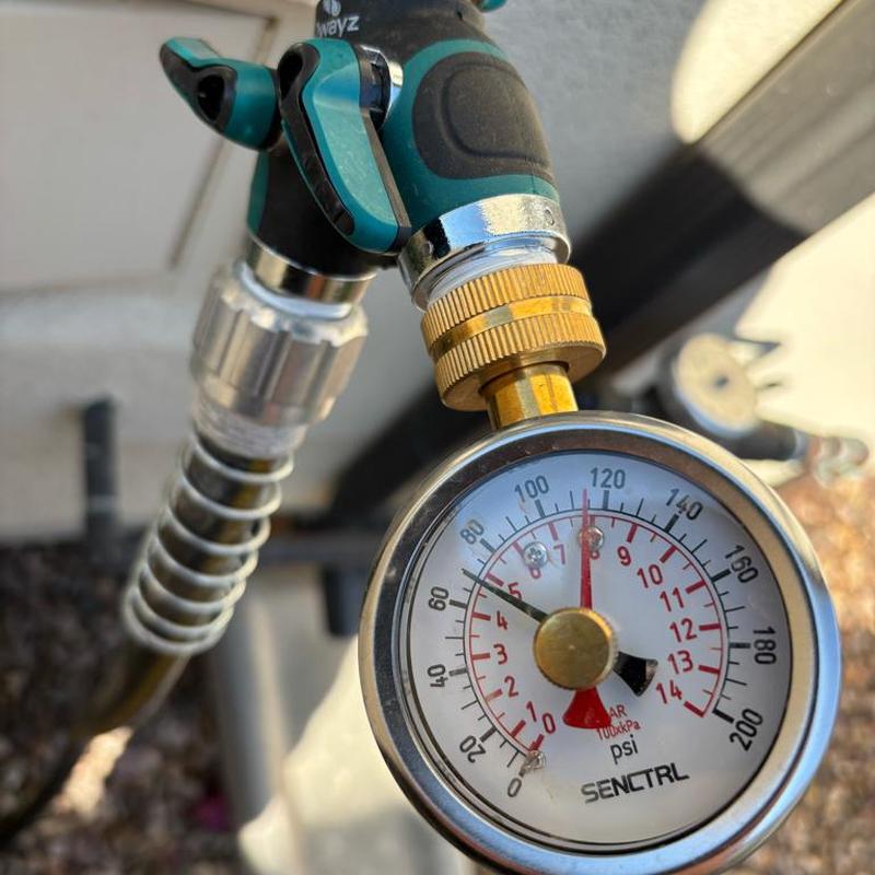 Pressure regulator valve gauge showing 65 psi reading Pressure regulator valve gauge showing 65 psi reading