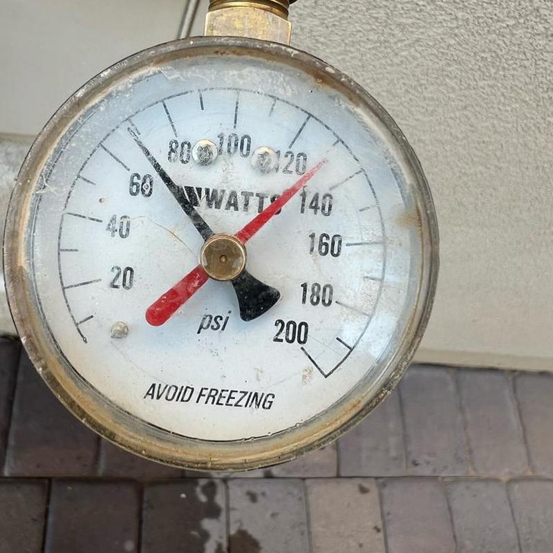Pressure regulator valve gauge showing 68 PSI reading Pressure regulator valve gauge showing 68 PSI reading