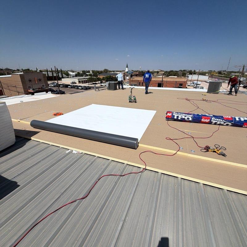 TPO roofing system installation over metal roof