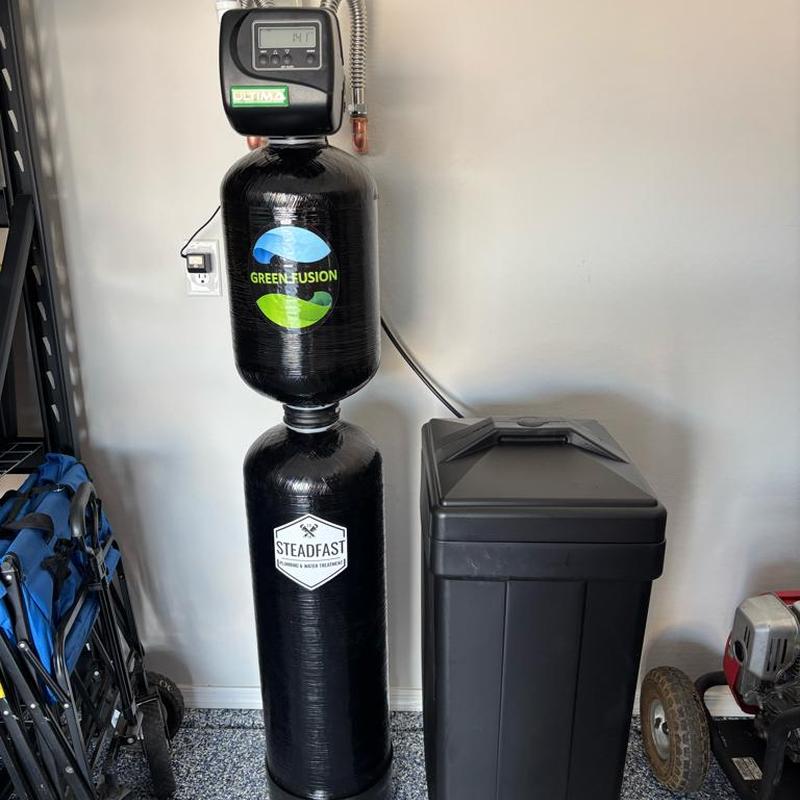 Green Titan 1,000 water softener system installed in garage Green Titan 1,000 water softener system installed in garage