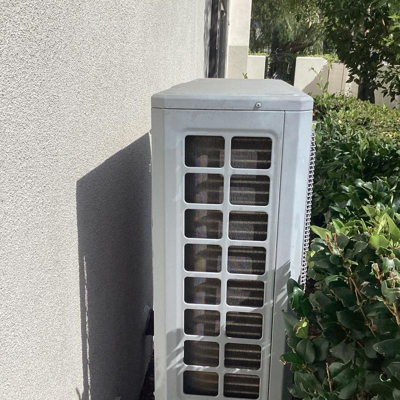 AC outdoor condenser unit during maintenance check AC outdoor condenser unit during maintenance check