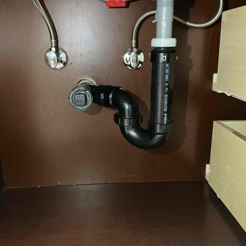 ABS P-trap and drain piping under bathroom sink ABS P-trap and drain piping under bathroom sink