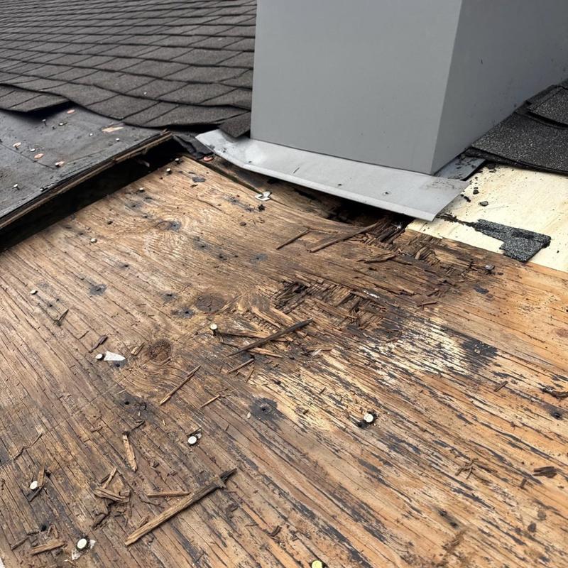OSB decking damage near roof chimney flashing OSB decking damage near roof chimney flashing