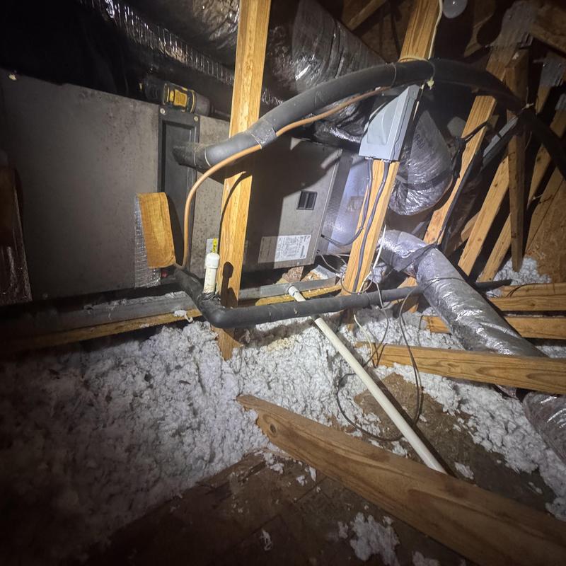 Heat pump split system in attic with ductwork
