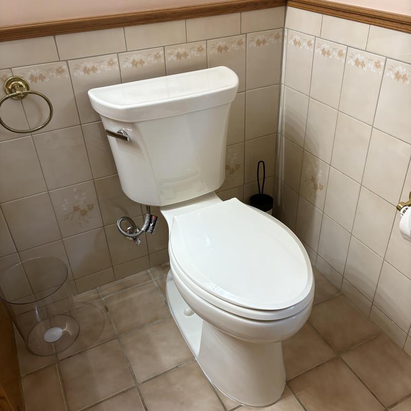 Two-piece Kohler toilet with soft close seat installed