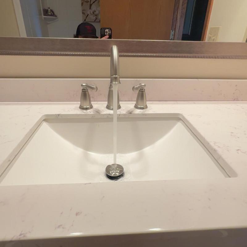 Bathroom faucet and vanity installation with running water Bathroom faucet and vanity installation with running water