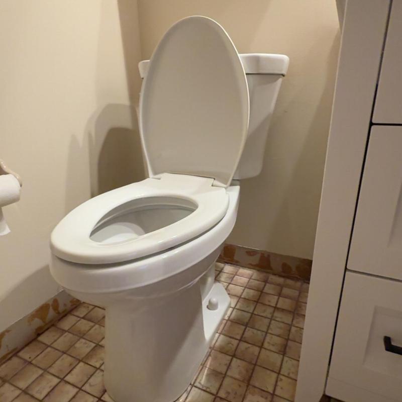 ADA compliant toilet installation with open lid ADA compliant toilet installation with open lid
