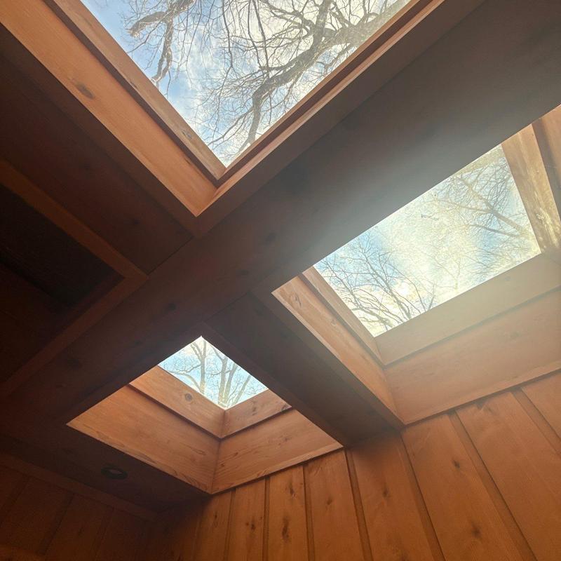 Skylight windows with wooden framing and ceiling beams