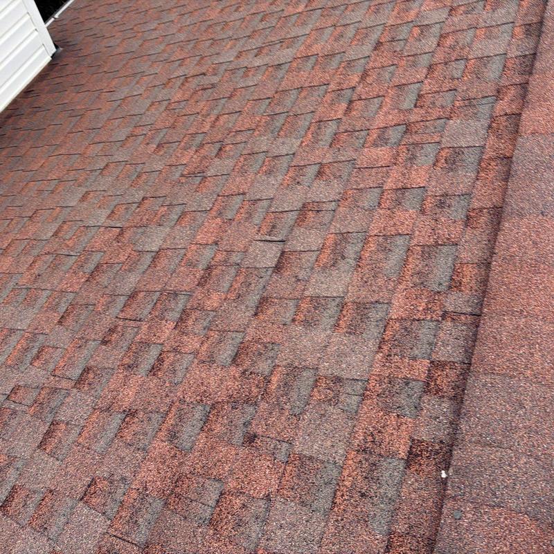 Asphalt roof shingles with hail damage on residential roof