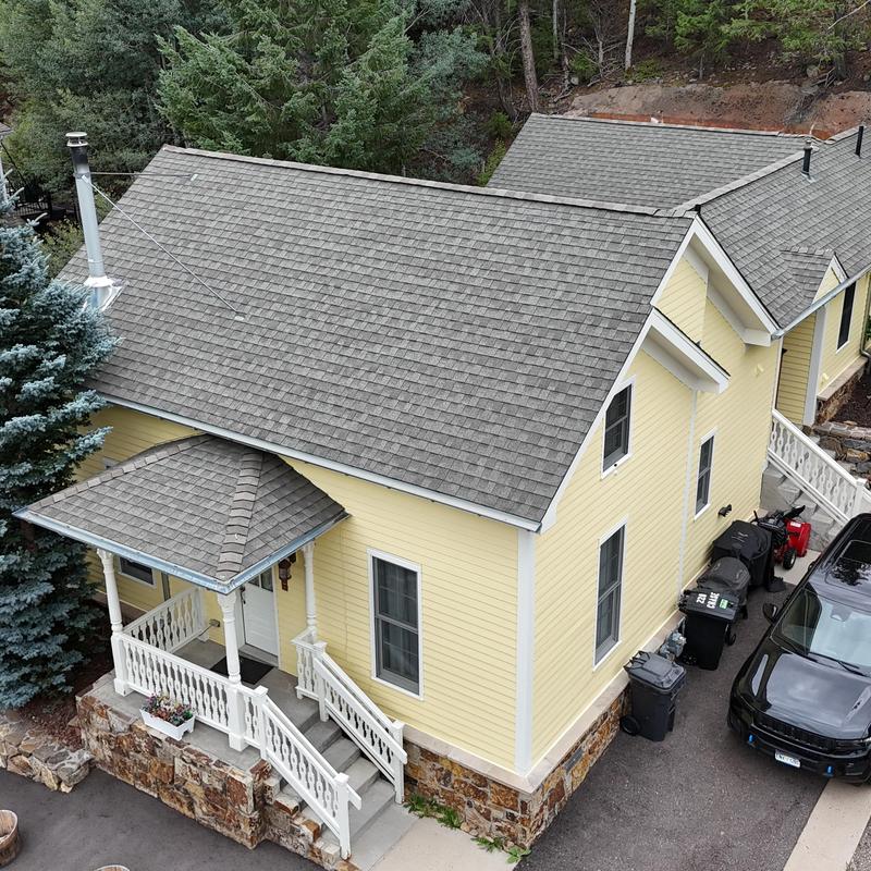 Asphalt shingle roof on yellow home in Blackhawk CO