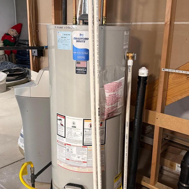 Water heater with pipes and valve inspection in basement Water heater with pipes and valve inspection in basement