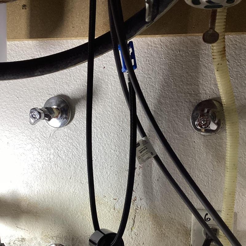 Angle stop valves beneath kitchen sink with piping Angle stop valves beneath kitchen sink with piping