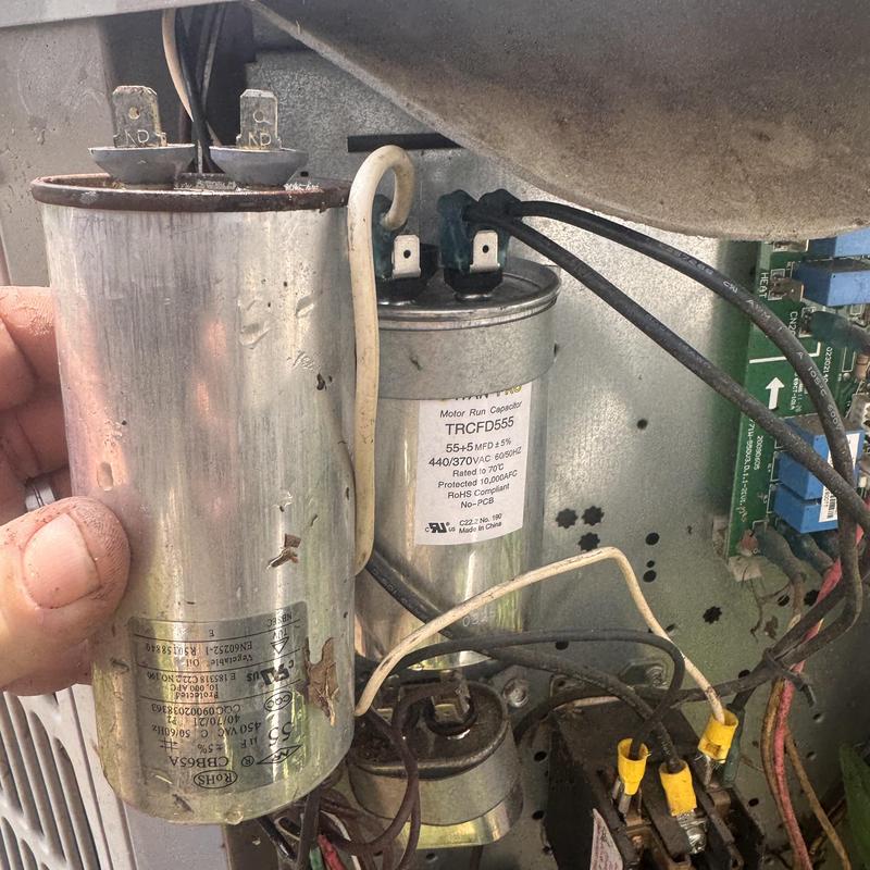 Heat pump motor run capacitors inside unit maintenance