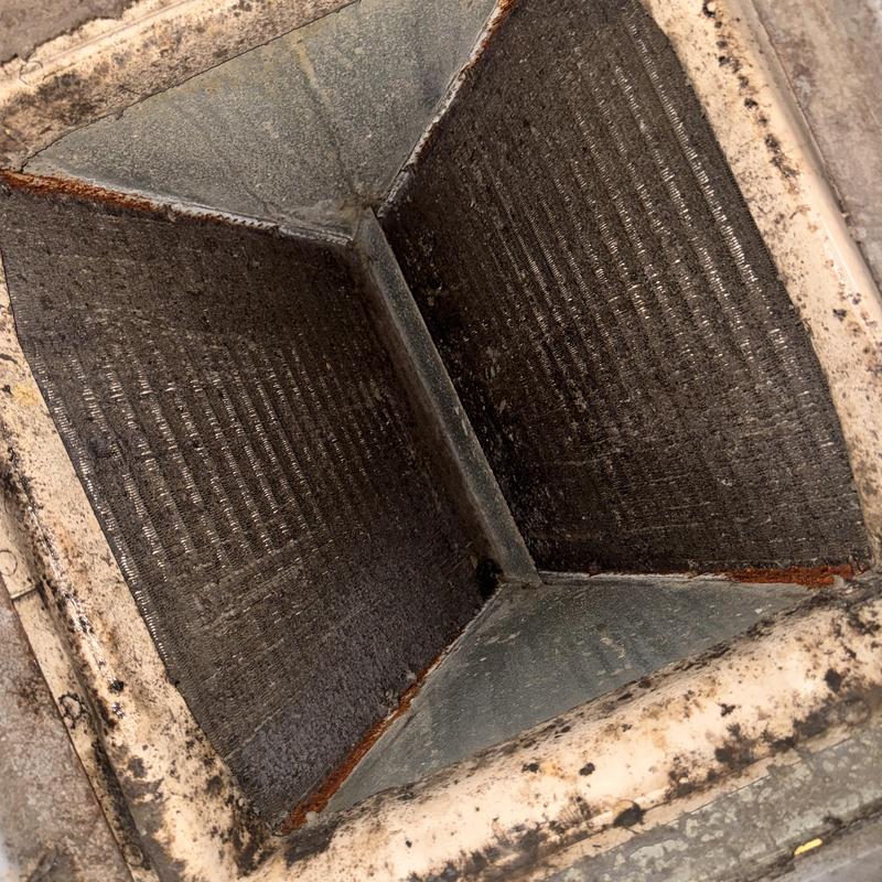 Heat pump coil with heavy dirt buildup and rust