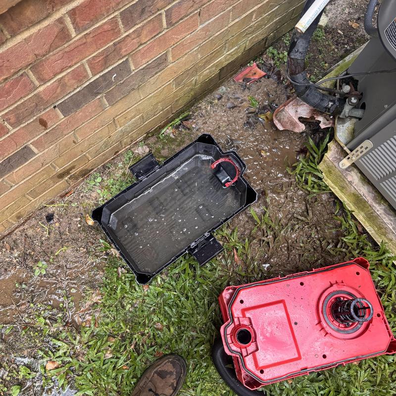 Heat pump condensate drain pan with debris and dirt