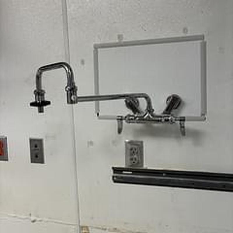 Pot filler faucet with wall mount in commercial space Pot filler faucet with wall mount in commercial space