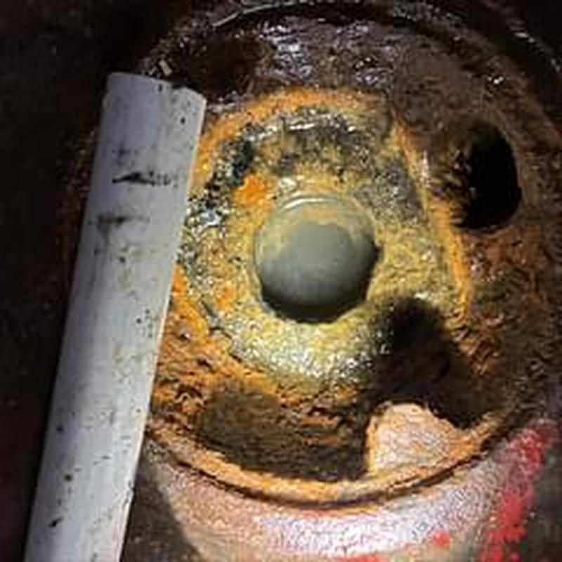 Basement floor drain with rust and corrosion buildup