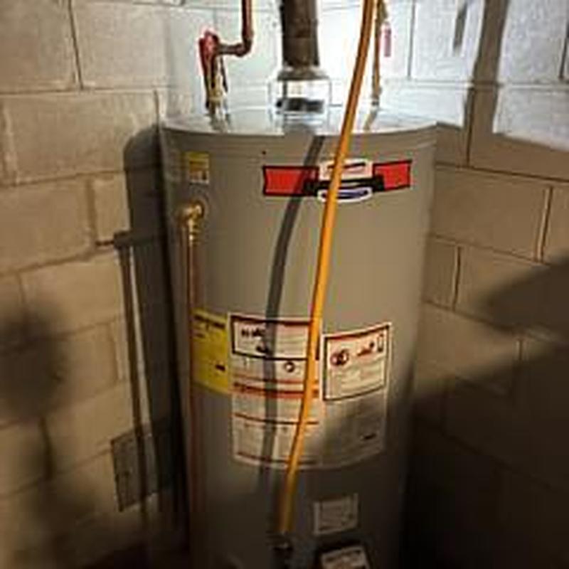75 gallon gas water heater installed in basement corner