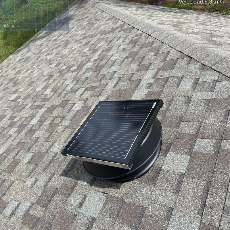 Solar powered attic fan on Owens Corning shingle roof Solar powered attic fan on Owens Corning shingle roof