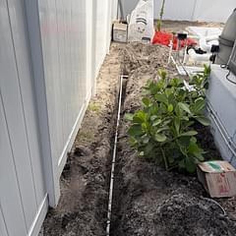 PVC pipe trench for pool filler reroute in yard PVC pipe trench for pool filler reroute in yard