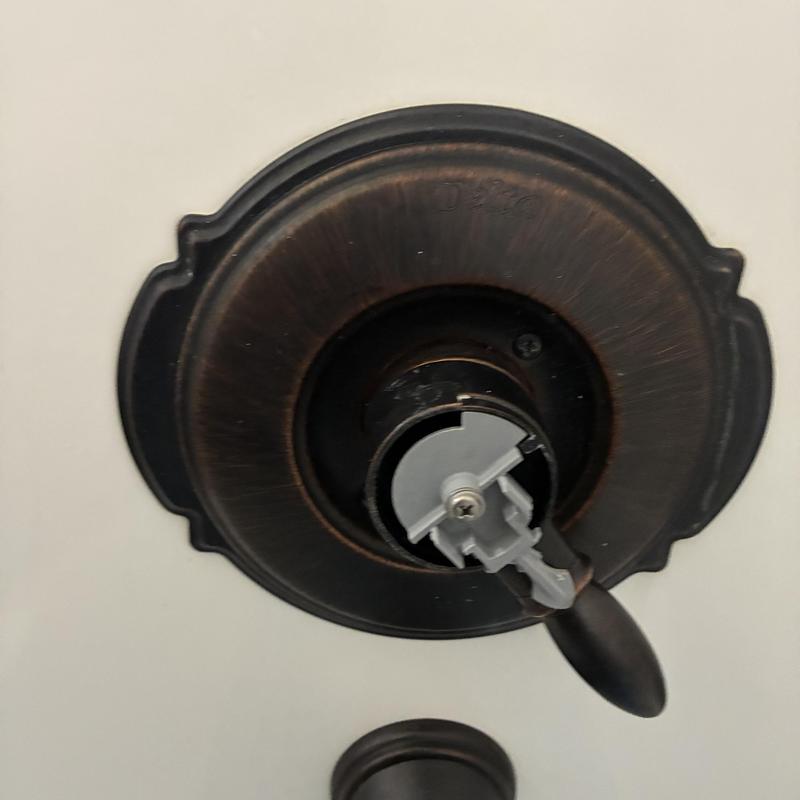 Shower faucet handle assembly with missing screw