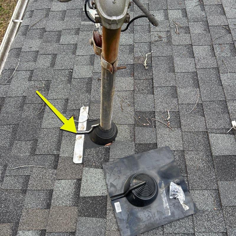 Roof pipe flashing with corrosion and removed boot on shingles