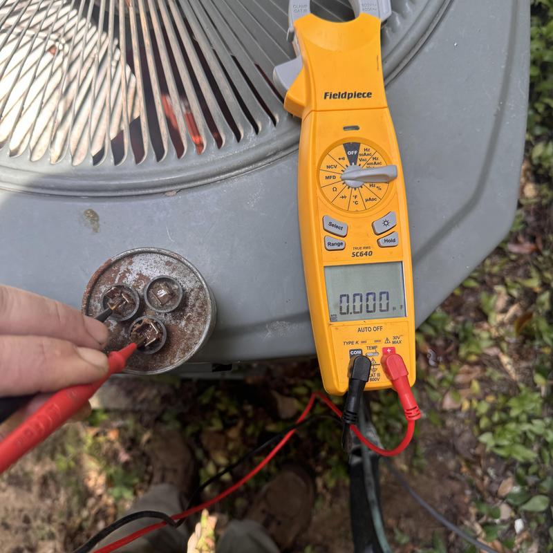 Heat pump capacitor testing with multimeter in Tallahassee