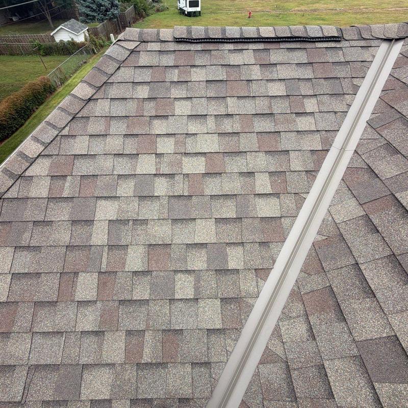 Asphalt shingle roof with metal ridge cap, no damage Asphalt shingle roof with metal ridge cap, no damage