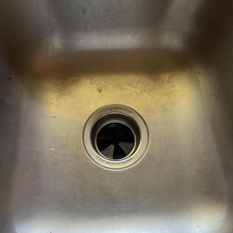 Garbage disposal sink drain in stainless steel sink Garbage disposal sink drain in stainless steel sink