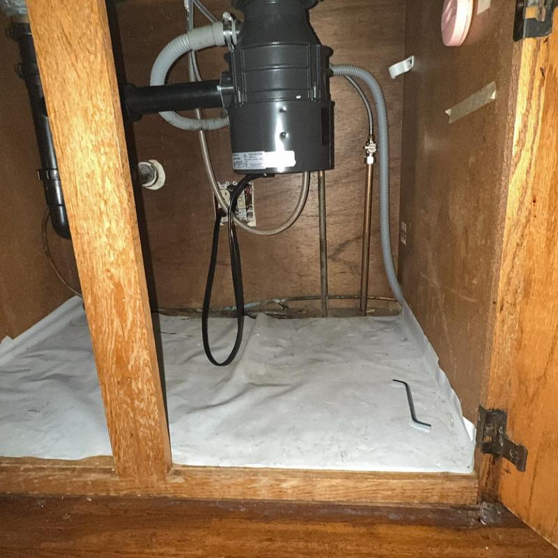 Garbage disposal and kitchen faucet under sink maintenance Garbage disposal and kitchen faucet under sink maintenance