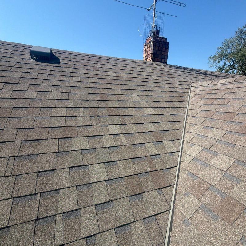 Asphalt shingle roof with chimney and antenna Asphalt shingle roof with chimney and antenna