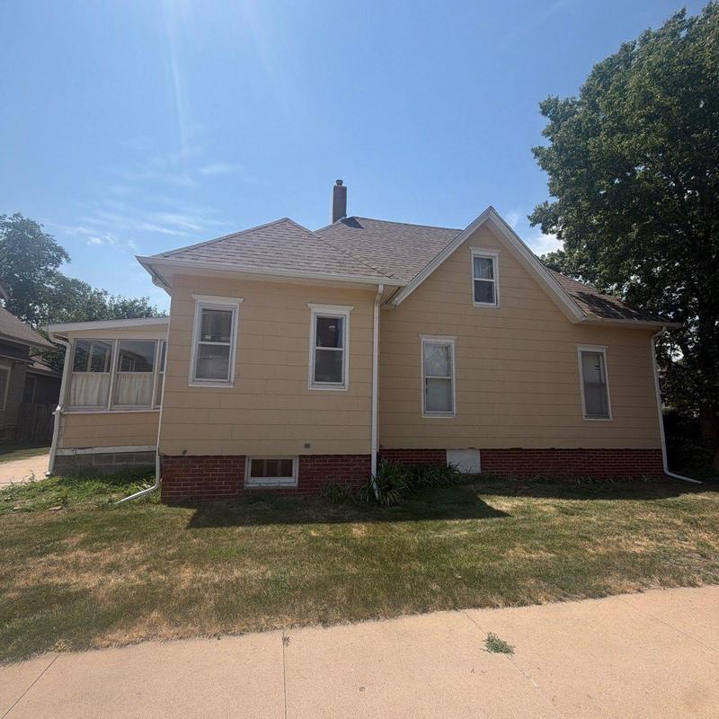 Asphalt shingle roof inspection on beige house Asphalt shingle roof inspection on beige house