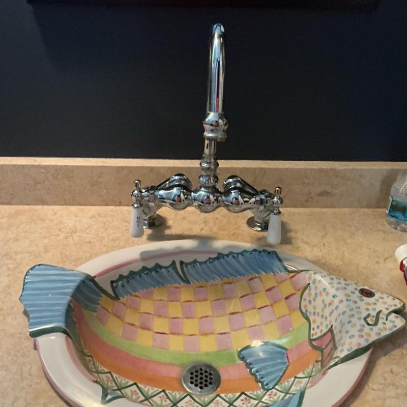 Bathroom sink faucet with vintage handles and fish basin Bathroom sink faucet with vintage handles and fish basin