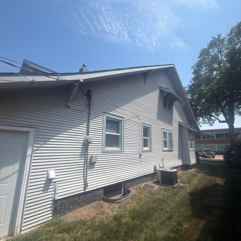 House siding and windows exterior under clear sky House siding and windows exterior under clear sky