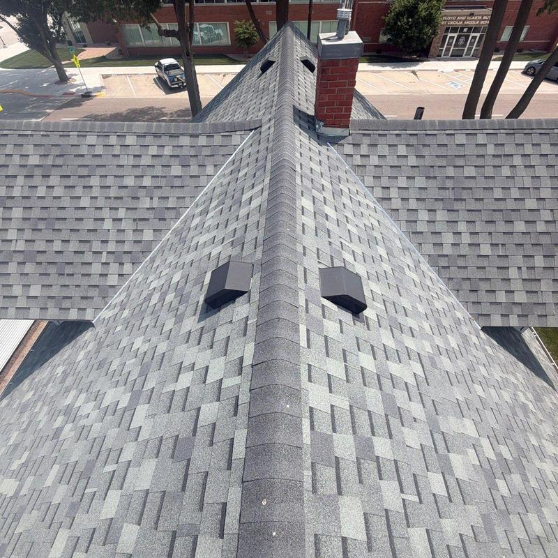 Asphalt shingle roof with vents and chimney detail Asphalt shingle roof with vents and chimney detail