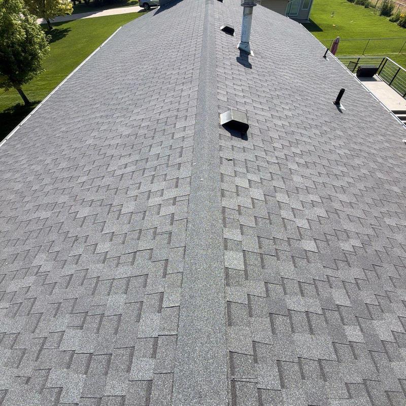 Asphalt shingle roof ridge inspection with vents visible Asphalt shingle roof ridge inspection with vents visible